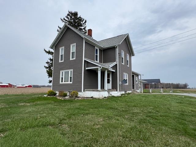 3649 Nazor Rd, Crestline, OH 44827 - view of home's exterior featuring a chimney and a lawn