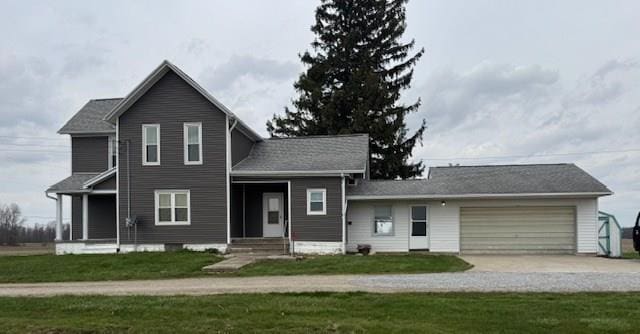 3649 Nazor Rd, Crestline, OH 44827 - view of front of property featuring a garage, concrete driveway, and a front lawn