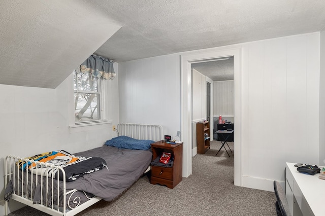 carpeted bedroom with a textured ceiling