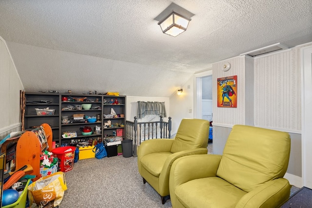 living area with a textured ceiling, carpet floors, and lofted ceiling