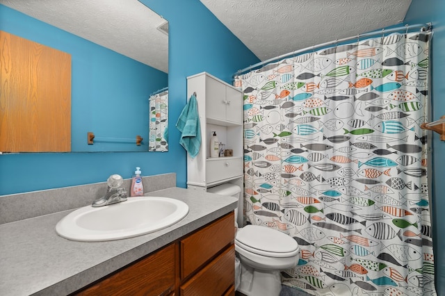 bathroom with vanity, a shower with curtain, a textured ceiling, and toilet