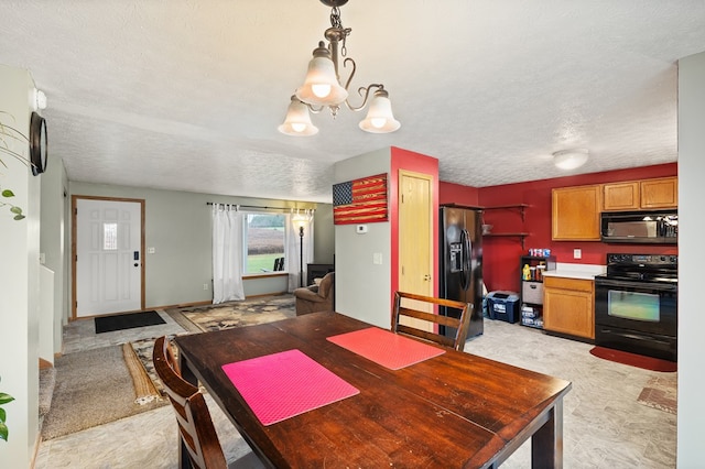 dining area featuring a chandelier and a textured ceiling