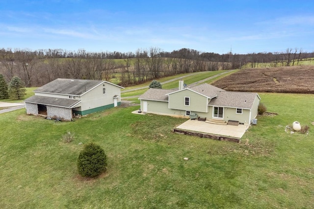 birds eye view of property with a rural view