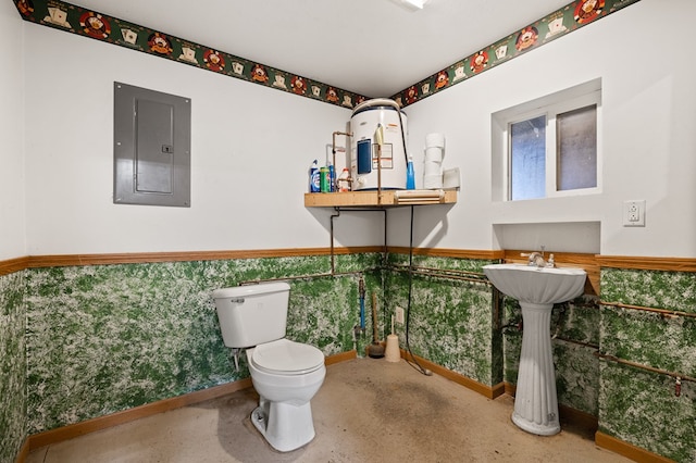 bathroom featuring toilet and electric panel