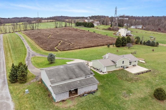 birds eye view of property featuring a rural view