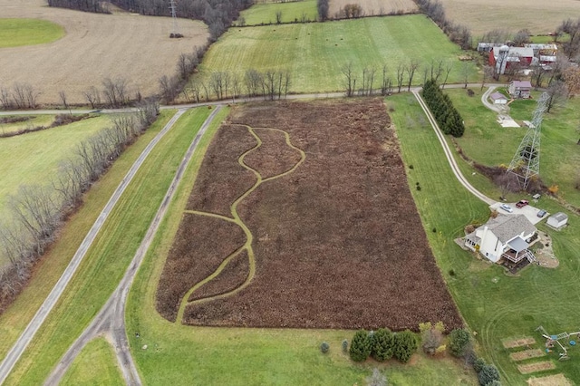 birds eye view of property with a rural view