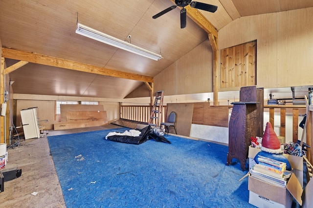 exercise area featuring ceiling fan, wood walls, lofted ceiling, and wooden ceiling