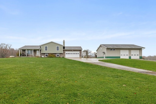 view of front of home featuring a garage and a front lawn