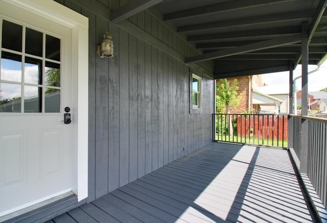 wooden terrace with a porch