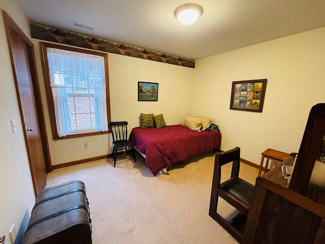 bedroom with light carpet