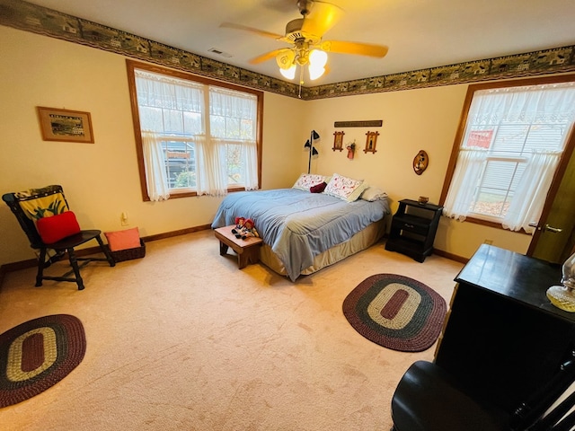 carpeted bedroom featuring ceiling fan