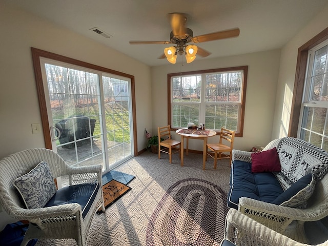 sunroom / solarium with ceiling fan