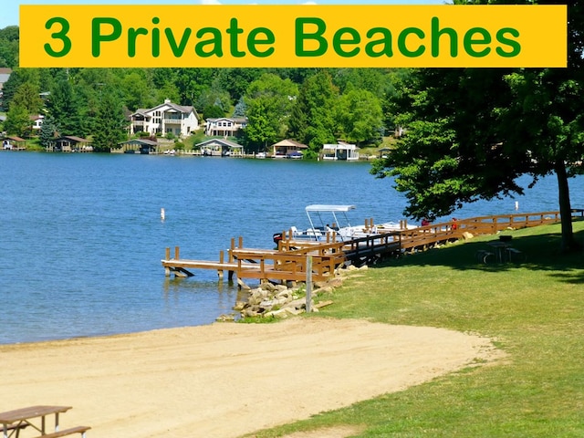 dock area featuring a yard and a water view