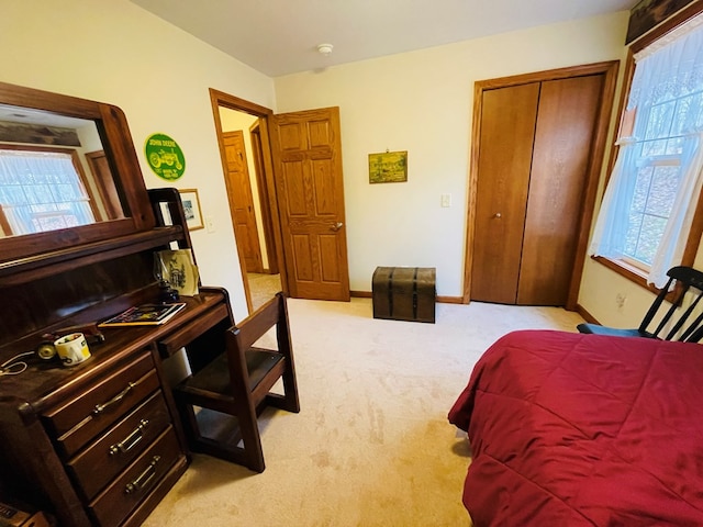 carpeted bedroom featuring a closet