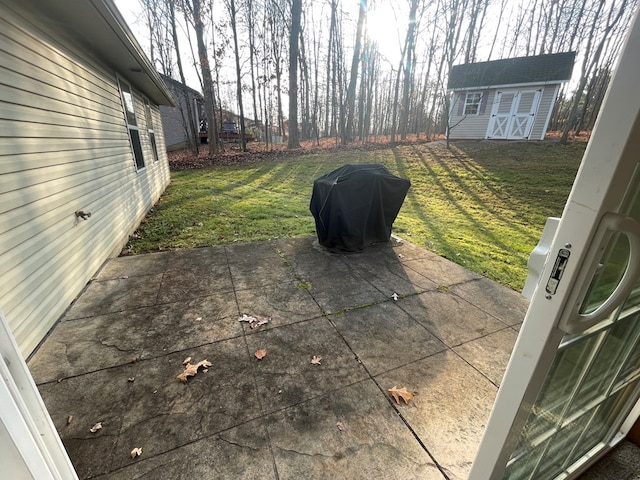 view of patio featuring grilling area and a storage shed