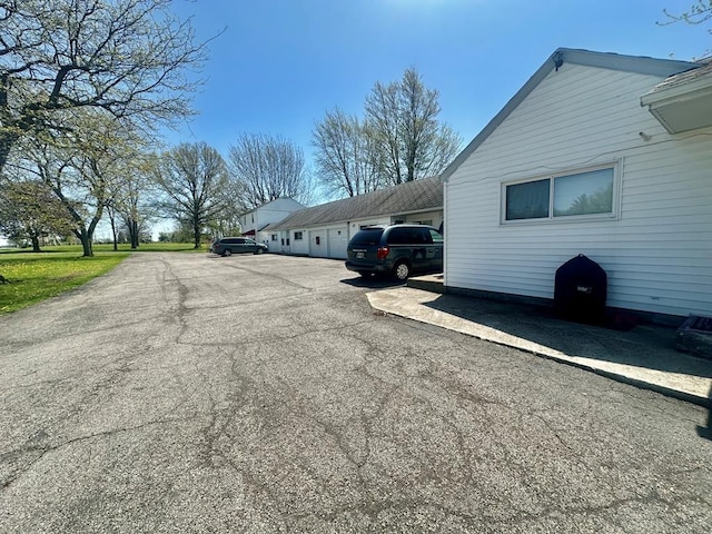 exterior space featuring aphalt driveway