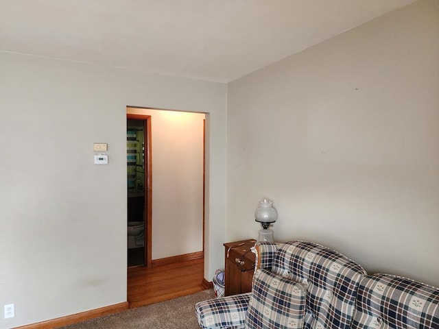 sitting room featuring carpet flooring