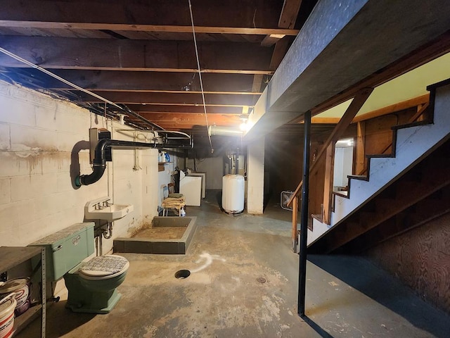 basement featuring sink and washer / clothes dryer