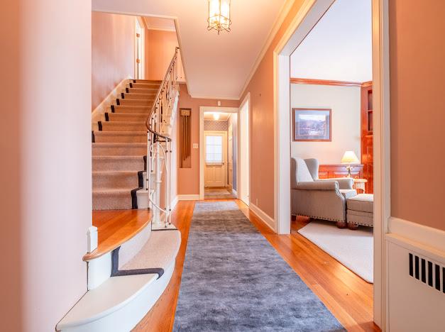 interior space with crown molding and hardwood / wood-style flooring