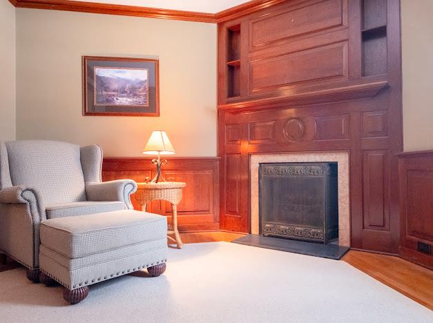 sitting room featuring light hardwood / wood-style floors and ornamental molding