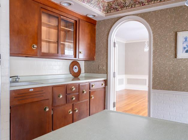 kitchen with crown molding and sink