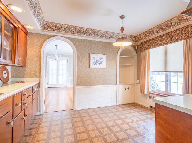 kitchen featuring pendant lighting and ornamental molding