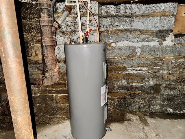 utility room featuring electric water heater