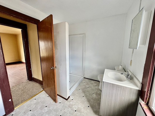 full bathroom with tile patterned floors, a stall shower, toilet, and vanity