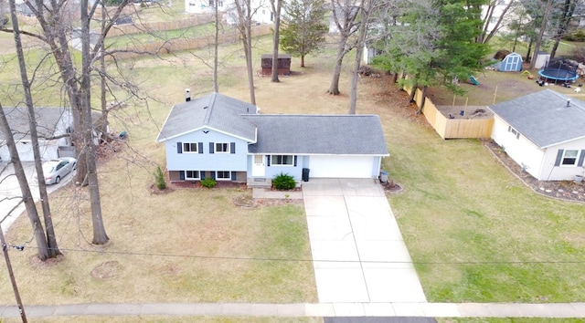 1690 Evergreen Ave W, Mansfield, OH 44905 - back of house featuring a wooden deck, a chimney, a yard, and roof with shingles