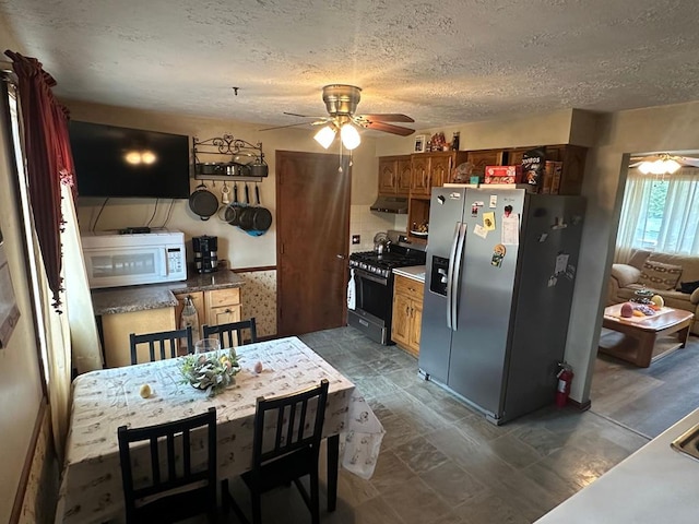 1690 Evergreen Ave W, Mansfield, OH 44905 - living area with stairs, a ceiling fan, baseboards, and light wood finished floors
