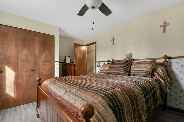 1690 Evergreen Ave W, Mansfield, OH 44905 - cinema featuring wood walls, a wood stove, a ceiling fan, and wood finished floors