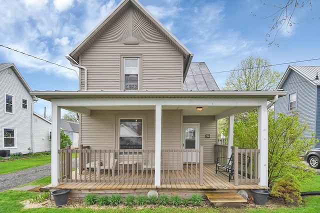 view of front facade with covered porch and central AC unit