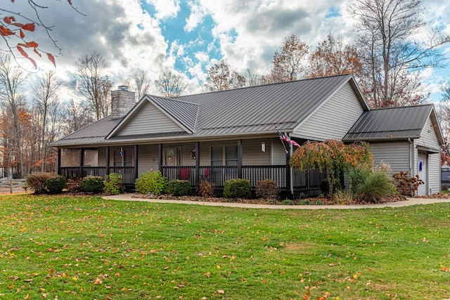 view of front of home featuring a garage, a porch, and a front yard