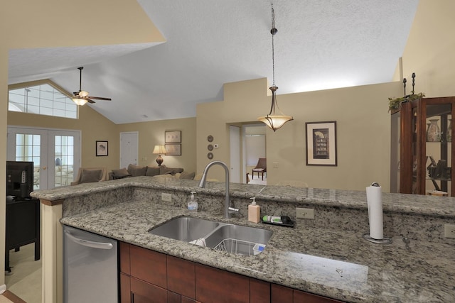810 Whippoorwill Ln, Mansfield, OH 44906 - kitchen featuring stainless steel dishwasher, lofted ceiling, a ceiling fan, pendant lighting, and open floor plan