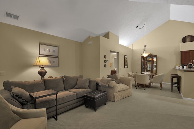 810 Whippoorwill Ln, Mansfield, OH 44906 - carpeted living area featuring vaulted ceiling and baseboards