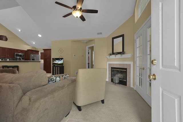 810 Whippoorwill Ln, Mansfield, OH 44906 - living area featuring vaulted ceiling, light carpet, a tile fireplace, recessed lighting, and ceiling fan