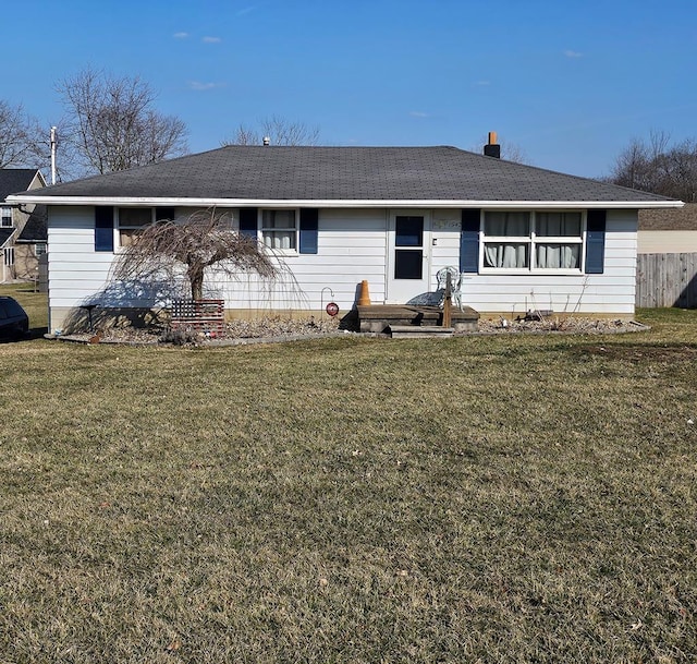 single story home featuring a front lawn and fence