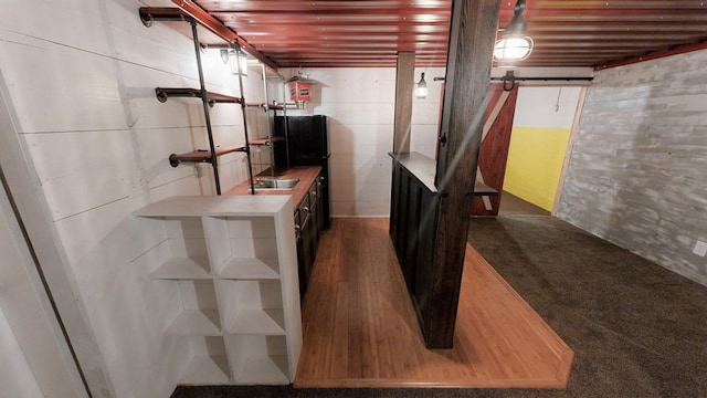 basement featuring black fridge