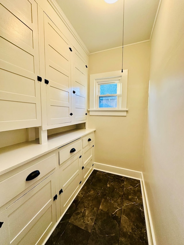 laundry room featuring ornamental molding