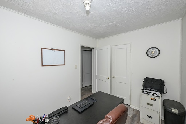 office area with dark wood-style floors and a textured ceiling