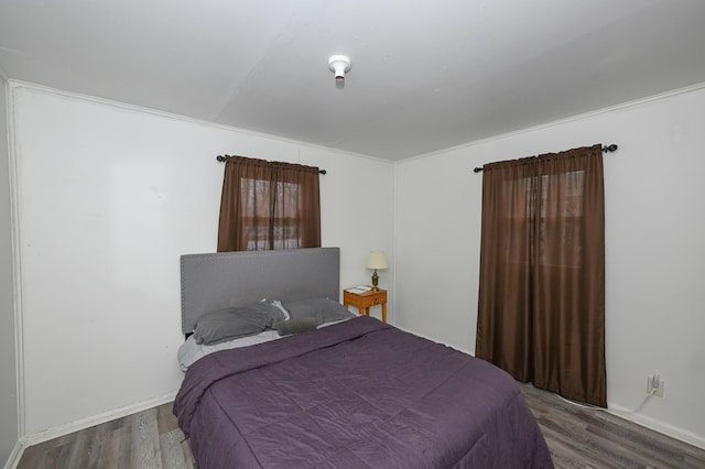 bedroom with wood finished floors