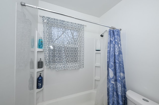 bathroom with toilet and shower / tub combo