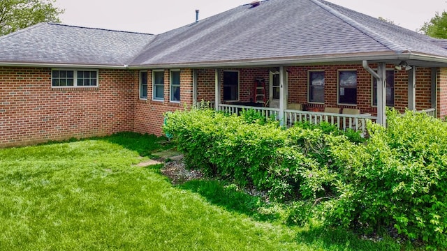 1320 Oakridge Rd, Bucyrus, OH 44820 - back of house featuring brick siding, a yard, and a shingled roof