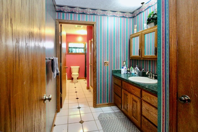 1320 Oakridge Rd, Bucyrus, OH 44820 - bathroom featuring tile patterned flooring, wallpapered walls, toilet, and vanity
