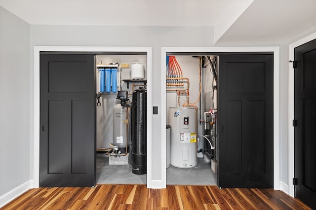 utility room featuring electric water heater