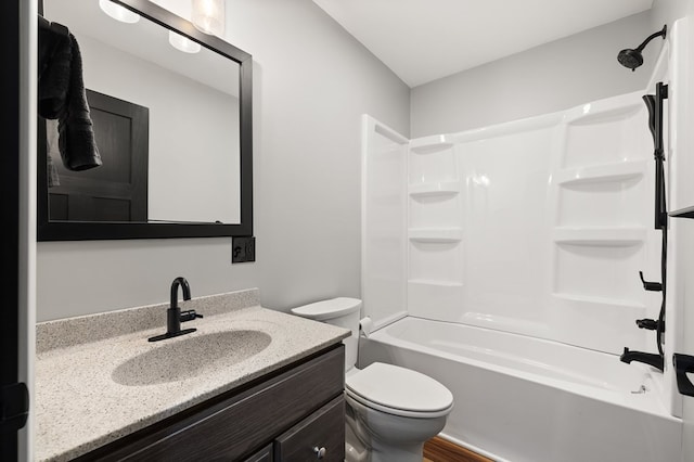 full bathroom with vanity, toilet, and shower / washtub combination