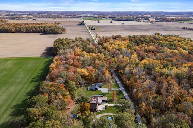 birds eye view of property with a rural view