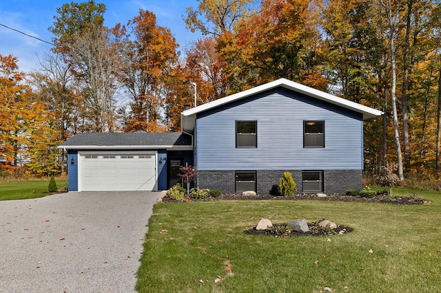 split level home featuring a garage and a front yard