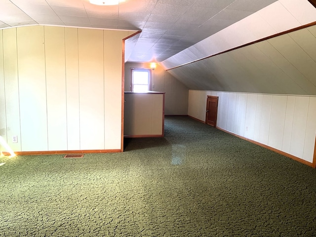 additional living space featuring vaulted ceiling