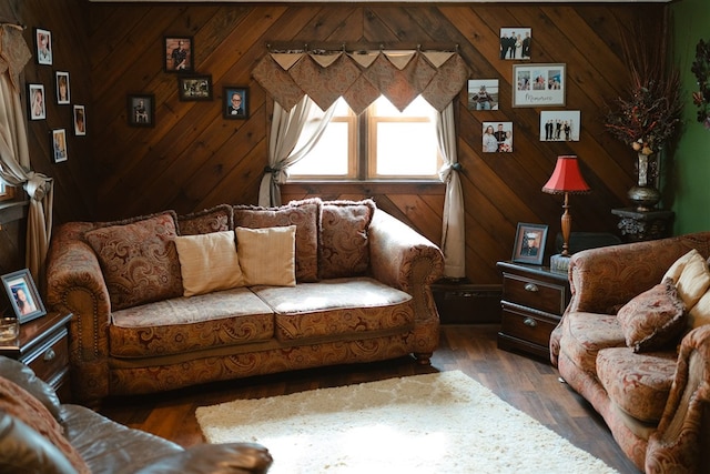 living area featuring wooden walls and wood finished floors